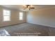Bedroom with plush carpet, a ceiling fan, and two windows at 85 Purslane Dr, Franklinton, NC 27525