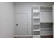White shelving and a rack for storage in the walk-in closet at 85 Purslane Dr, Franklinton, NC 27525