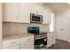 Modern kitchen features white cabinets, granite countertops, and stainless steel appliances at 85 Purslane Dr, Franklinton, NC 27525