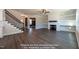 Open-concept living room with stairway, fireplace, built-in shelves, and seamless flow at 85 Purslane Dr, Franklinton, NC 27525