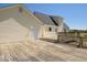Side angle view of a wooden deck with multiple access points to the house at 850 Cheatham Mabry Rd, Henderson, NC 27537
