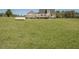 Exterior shot of a spacious grassy backyard with mature trees and room to roam at 850 Cheatham Mabry Rd, Henderson, NC 27537