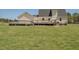 A sprawling backyard with a wooden deck, offering ample space for outdoor activities and enjoying the outdoors at 850 Cheatham Mabry Rd, Henderson, NC 27537