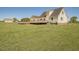Spacious backyard featuring a large lawn and a wooden deck at 850 Cheatham Mabry Rd, Henderson, NC 27537