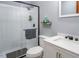 Bathroom featuring a tiled shower with a glass door, toilet and a vanity with a sink, creating a functional space at 850 Cheatham Mabry Rd, Henderson, NC 27537