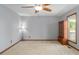 Bedroom featuring carpet, natural light, and decorative furniture offering a comfortable and inviting space at 850 Cheatham Mabry Rd, Henderson, NC 27537