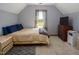 Bedroom featuring carpet, bed, dresser, tv, and window with outdoor view at 850 Cheatham Mabry Rd, Henderson, NC 27537