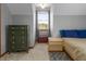 Bedroom showcasing a bed, windows with natural light, and minimalist decor at 850 Cheatham Mabry Rd, Henderson, NC 27537