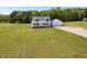 Exterior view of a charming house with a large yard and a two-car garage at 850 Cheatham Mabry Rd, Henderson, NC 27537