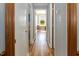 Hallway with hardwood floors and white doors showcasing a bright interior and inviting atmosphere at 850 Cheatham Mabry Rd, Henderson, NC 27537