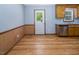 Kitchen features wood cabinets, stainless steel dishwasher and hardwood floors at 850 Cheatham Mabry Rd, Henderson, NC 27537