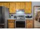 Cozy kitchen features wood cabinets, stainless steel appliances and hardwood floors at 850 Cheatham Mabry Rd, Henderson, NC 27537