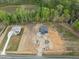 Aerial view of gray home and other new construction properties in the neighborhood at 8620 Dukes Lake Rd, Zebulon, NC 27597