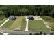 New home construction in an established neighborhood with a long driveway and mature trees at 8620 Dukes Lake Rd, Zebulon, NC 27597