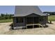 Exterior elevation of screened-in back porch at 8620 Dukes Lake Rd, Zebulon, NC 27597