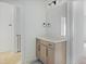 Bathroom featuring a modern vanity with a white countertop and neutral-colored cabinets at 8620 Dukes Lake Rd, Zebulon, NC 27597