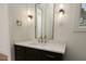 Stylish bathroom with a modern vanity, bronze fixtures, and a decorative mirror at 8620 Dukes Lake Rd, Zebulon, NC 27597