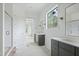Bathroom featuring marble countertops and custom cabinets, with walk-in shower visible at 8620 Dukes Lake Rd, Zebulon, NC 27597