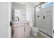 Bathroom features a vanity, walk-in shower, and black hardware for a modern feel at 8620 Dukes Lake Rd, Zebulon, NC 27597