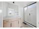 Bathroom features a modern vanity and shower with a glass door at 8620 Dukes Lake Rd, Zebulon, NC 27597