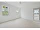 Bright bedroom with two large windows and a ceiling fan at 8620 Dukes Lake Rd, Zebulon, NC 27597