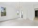 Spacious bedroom featuring an ensuite bathroom and ample natural light from several windows at 8620 Dukes Lake Rd, Zebulon, NC 27597