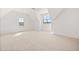 Spacious bedroom featuring vaulted ceilings and multiple windows for plenty of natural light at 8620 Dukes Lake Rd, Zebulon, NC 27597