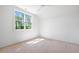 Bright bedroom with a large window offers natural light and space ready for customization at 8620 Dukes Lake Rd, Zebulon, NC 27597