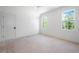Inviting bedroom features two windows and a door ready for flooring at 8620 Dukes Lake Rd, Zebulon, NC 27597
