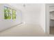 Bright bedroom with neutral carpet, a window view, and a closet at 8620 Dukes Lake Rd, Zebulon, NC 27597