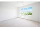 Bright bedroom with a large window, ceiling fan and ready for flooring and personalization at 8620 Dukes Lake Rd, Zebulon, NC 27597