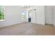 This bedroom offers bright, natural light with a sliding door entry to an ensuite bathroom at 8620 Dukes Lake Rd, Zebulon, NC 27597