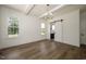 Dining room featuring hardwood flooring, a modern chandelier, and a sliding barn door at 8620 Dukes Lake Rd, Zebulon, NC 27597