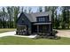 Front facade of craftsman-style home featuring a well-maintained lawn and landscaping at 8620 Dukes Lake Rd, Zebulon, NC 27597