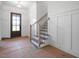 Foyer showcasing a staircase and front door with plenty of natural light at 8620 Dukes Lake Rd, Zebulon, NC 27597