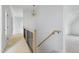 Open hallway with hardwood floors, recessed lighting and a staircase at 8620 Dukes Lake Rd, Zebulon, NC 27597