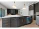 Kitchen featuring a center island, dark cabinetry, stainless steel appliances, and open to living area at 8620 Dukes Lake Rd, Zebulon, NC 27597