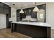 Stunning kitchen featuring gray cabinets, a white countertop island, and modern lighting at 8620 Dukes Lake Rd, Zebulon, NC 27597