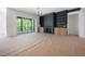 Living room with a fireplace, built-in shelves and access to the screened-in porch at 8620 Dukes Lake Rd, Zebulon, NC 27597