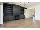 Spacious living room featuring a fireplace, hardwood floors and built-in shelves at 8620 Dukes Lake Rd, Zebulon, NC 27597