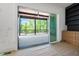 Screened in porch featuring ceiling fan and wooded outdoor view at 8620 Dukes Lake Rd, Zebulon, NC 27597