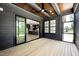Relaxing screened porch featuring wood ceiling and sliding glass doors to kitchen at 8620 Dukes Lake Rd, Zebulon, NC 27597