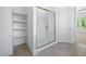Beautifully designed shower with white tiled walls, marble floor, and a glass door enclosure at 8620 Dukes Lake Rd, Zebulon, NC 27597