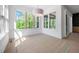 Sun Room with natural light and large windows, creating a bright and airy space at 8620 Dukes Lake Rd, Zebulon, NC 27597