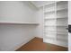 Walk-in closet featuring built-in shelves, organizers, and ample storage space at 8620 Dukes Lake Rd, Zebulon, NC 27597