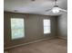 Bedroom featuring two windows at 8650 Neuse Landing Ln # 101, Raleigh, NC 27616