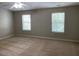 Bedroom featuring two windows at 8650 Neuse Landing Ln # 101, Raleigh, NC 27616