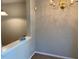 Bright living room with chandelier next to kitchen at 8650 Neuse Landing Ln # 101, Raleigh, NC 27616