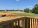 Home's spacious backyard and green space from the porch at 89 Grove Township Way, Angier, NC 27501
