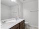 This primary bathroom features double sinks, a large mirror, and a shower with great natural light at 89 Grove Township Way, Angier, NC 27501